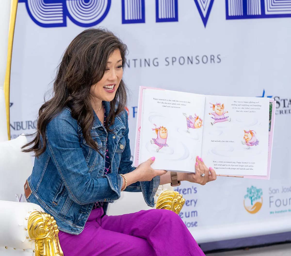 Kristi Yamaguchi reading from her book Dream Big Little Pig at a literacy festival.