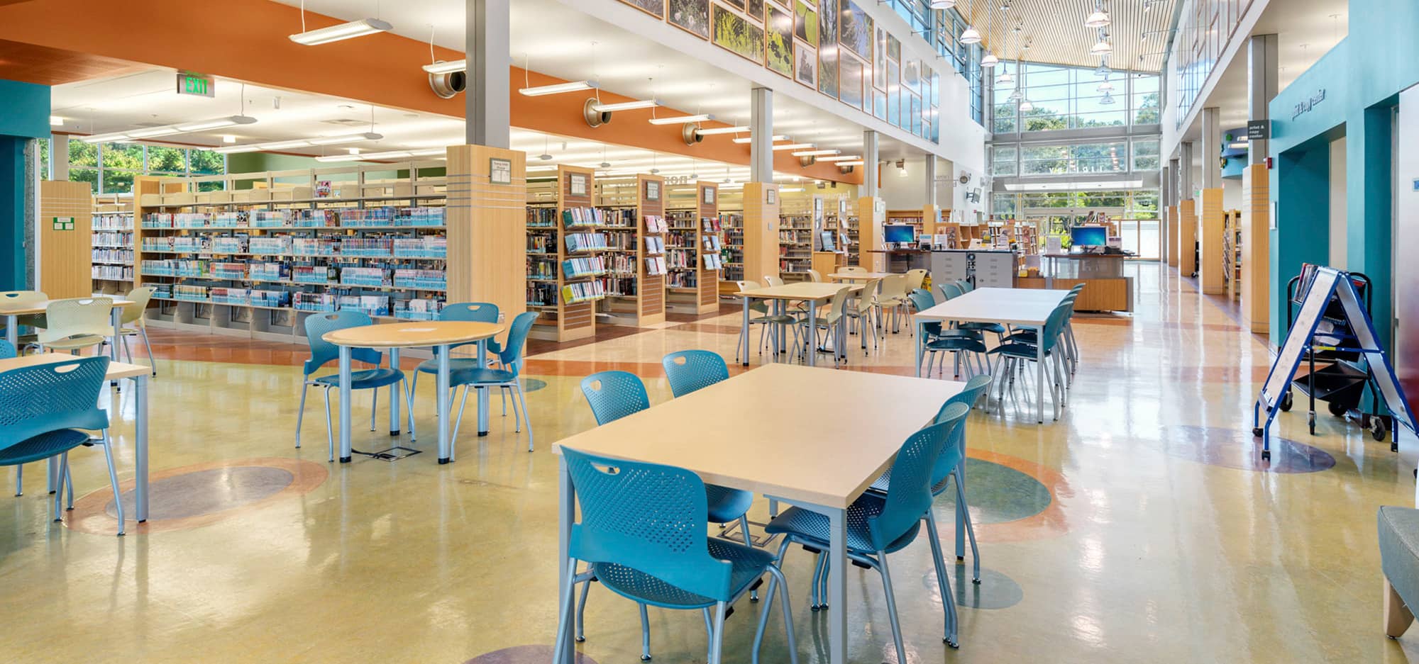 Library Interior including tables and bookshelves.