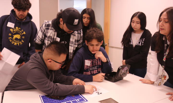 Students work together to solve a puzzle.