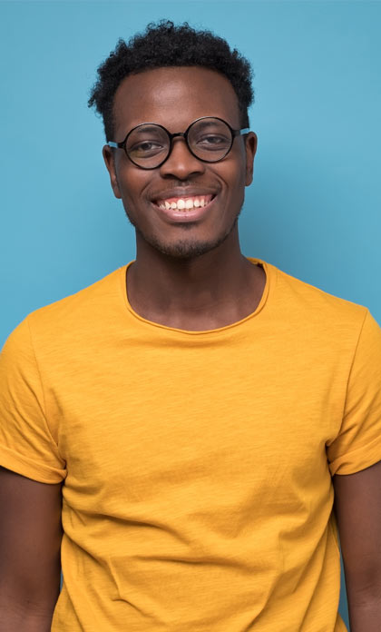 An adult library patron smiling.